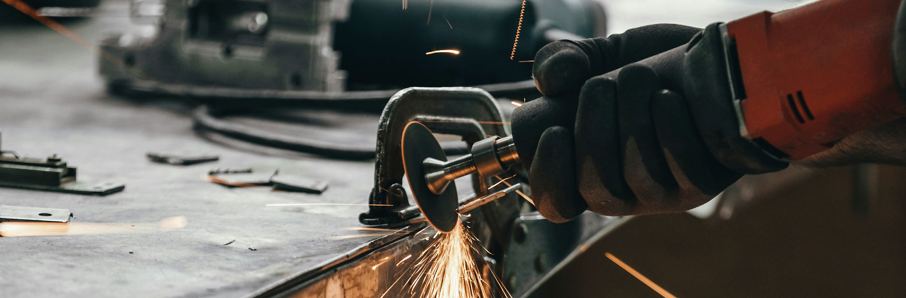 man cutting metal